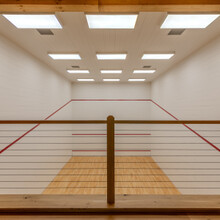 loft overlooking an indoor squash court